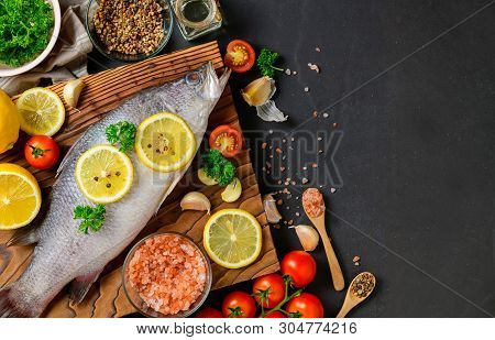 Fresh Fish Seabass And Ingredients For Cooking.