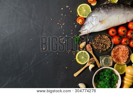 Fresh Fish Seabass And Ingredients For Cooking.