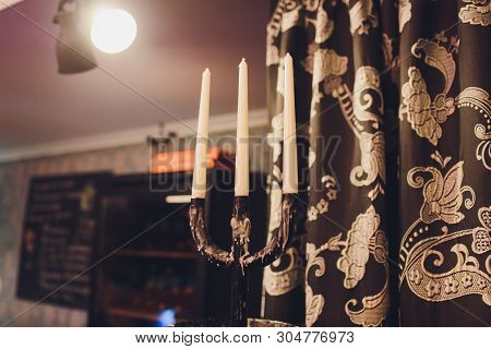 Triple Vintage Candlestick Made Of Glass And Black Metal, Two White Stearin Candles And One Candle E