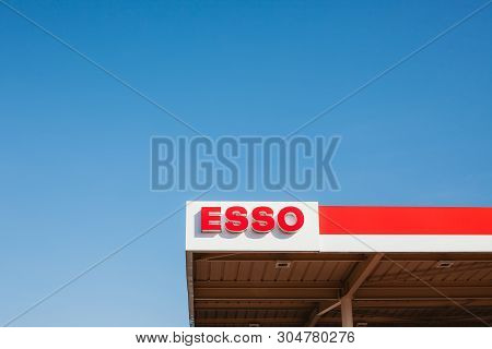 Lyon, France - February 26, 2019: Esso Logo On Its Gas Service Station In Lyon, France On Blue Sky B