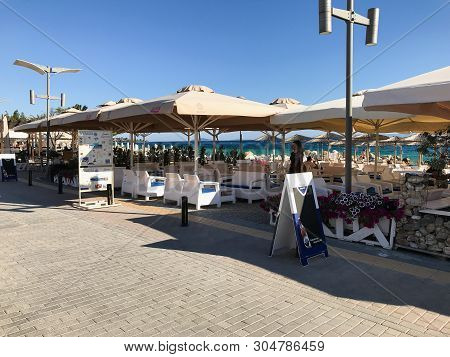 Halkidiki, Nikiti, Greece - May 29, 2019: Restaurants And Bars Nicely Arranged Along The Beach Of Ni