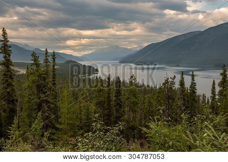 A View From The Road Of The Beautiful Muncho Lake In Canada Framed By The Pine Forests, Nobody In Th