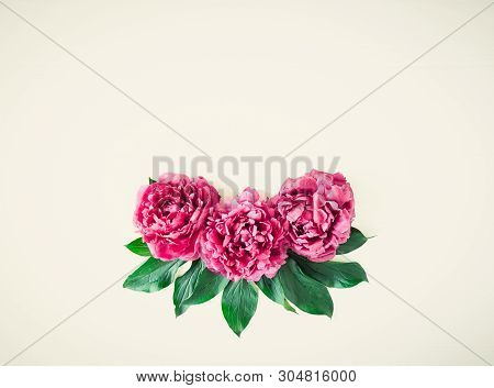 Flower Border Composition Made Of Bright Pink Buds Peony Bouquet On A White Wooden Background. Flora