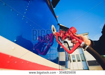 The Helicopter Is Refueling On The Helideck.