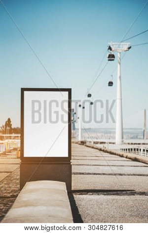 A Street Advert Banner Mockup On The Quayside; An Empty Ad Poster Template In Urban Settings With Ca