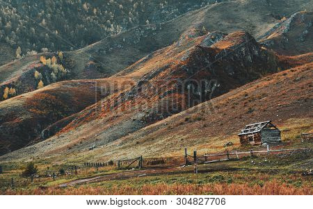 Amazing Fall Mountain Scenery With A Small Abandoned Unfinished Wooden Shack On The Right With An Ol