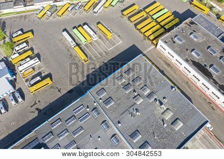 Aerial View Of City Bus Depot With Parked Buses And Service Buildings