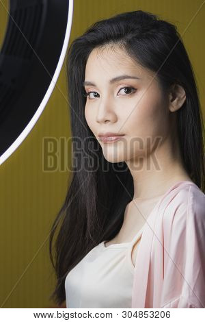 Beautiful Asian Woman Model  Take A Selfie Photo In Front Of Studio Light.