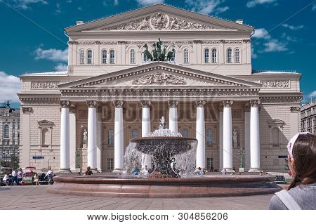 Moscow, Russia - Jun 5, 2019: View Of Big Theater Building With A Tourist In The Right Side. Classic