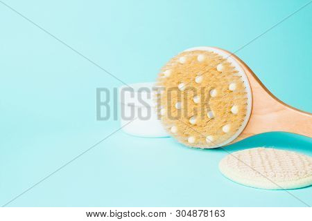 Body Massage Brush With Cream On Blue Background. Massage Brush For The Body. Skin Care Products. Sp