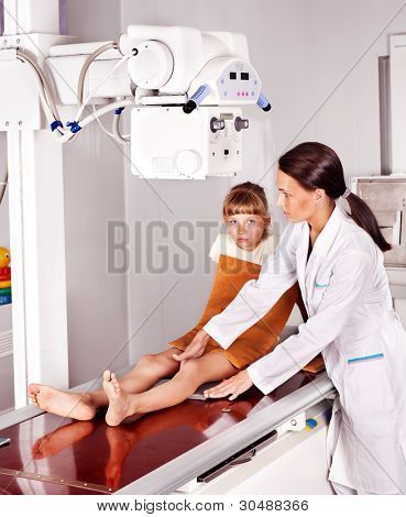 Little girl with doctor radiologist.