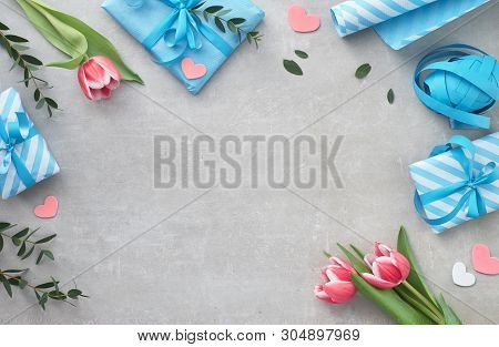 Springtime Flat Lay With Giift Boxes, Seasonal Flowers And Eucalyprus Leaves, Space For Your Text