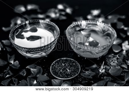 Milk Face Pack For Clear Complexion On Shiny Black Wooden Surface I.e. Raw Milk Well Mixed With Sand