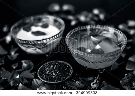Milk Face Pack For Clear Complexion On Shiny Black Wooden Surface I.e. Raw Milk Well Mixed With Sand