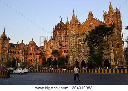 Mumbai, India - January, 2017: Man Is Running Across A Road Near Chhatrapati Shivaji Terminus Railwa
