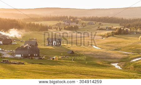 Jizerka Village At Sunset Time. View From Bukovec Mountain, Jizera Mountains, Czech Republic