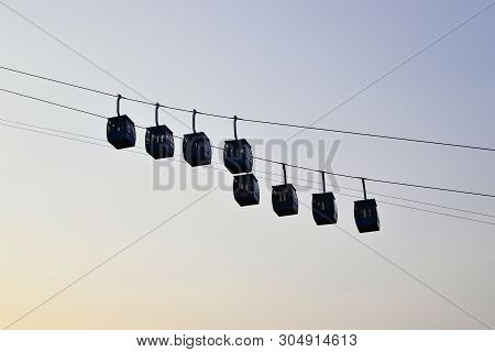 Ropeway Cabins Against Clear Sky. Rope Way To The Savitri Mata Temple On The Hill Near Pushkar City.