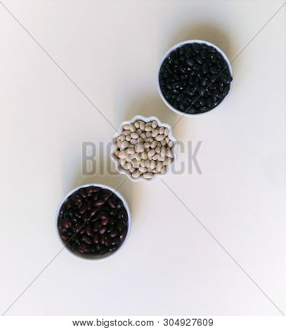 Flatley Beans In Bowls On A White Background With Space For Text. Copyspace.