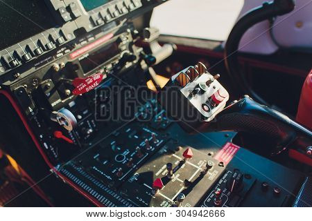 Black Control Panel In A Helicopter Cockpit.