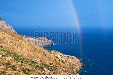 Wild Hilly Coastline Of Creta Island After A Rain With A Rainbow