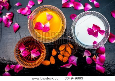 Milk And Almond Face Pack On Black Colored Shiny Surface I.e. Raw Milk,almond,honey Well Mixed In A