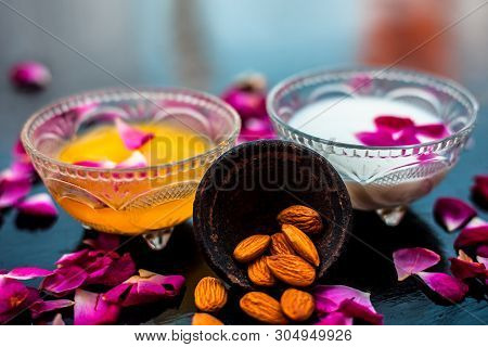 Milk And Almond Face Pack On Black Colored Shiny Surface I.e. Raw Milk,almond,honey Well Mixed In A