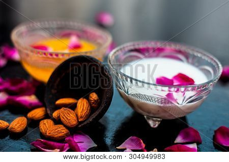 Milk And Almond Face Pack On Black Colored Shiny Surface I.e. Raw Milk,almond,honey Well Mixed In A