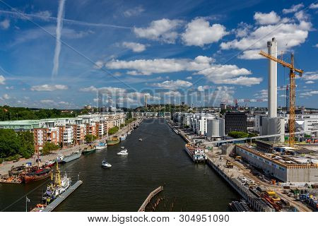 Stockholm, Sweden - July 11, 2014: Panoramic View Of A Wide Water Canal With Surrounding Residential