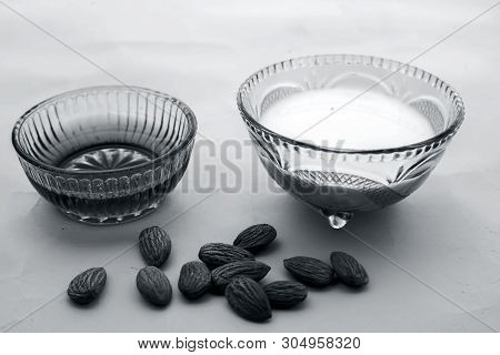 Milk And Almond Face Pack On Isolated On Pink Surface I.e. Raw Milk,almond,honey Well Mixed In A Gla