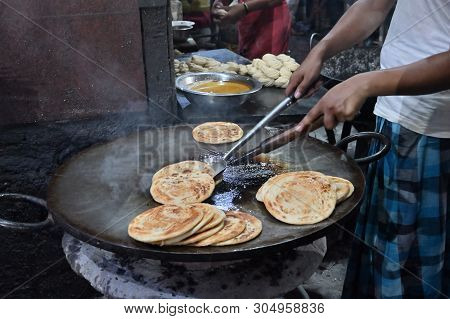 Lachcha Parathas Are Being Prepared With Heat In Fry Pan , At Evening For Sale As Street Food In Kol