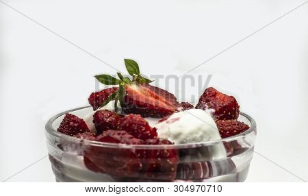 Red Ripe Sweet Strawberries With Ice Cream In A Ice-cream Bowl On A White Background