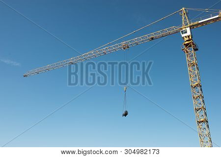 Crane. Construction Crane. Huge Crane Against Blue Sky. Tower Crane.