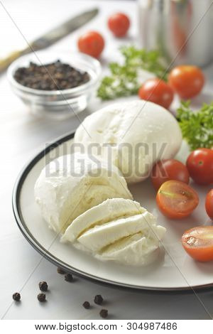 Mozzarella Cheese And Cherry Tomatoes With Spices. Homemade Mozzarella Cheese, Isolated.