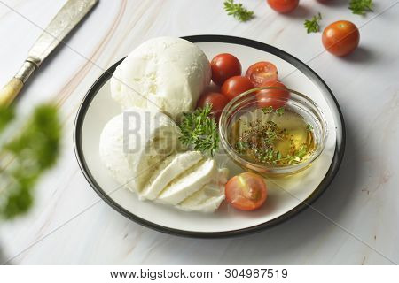 Mozzarella Cheese And Cherry Tomatoes With Spices. Homemade Mozzarella Cheese, Isolated.
