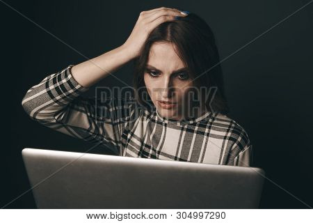 Teen Girl Excessively Sitting At The Computer Laptop At Home. He Is A Victim Of Online Bullying Stal