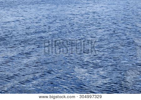 Light Playing On The Sea Surface. Water Surface. Sea Surface. Water Background. Blue Water Surface.