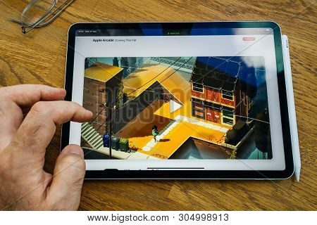 Paris, France - Mar 27, 2019: Pov Personal Perspective On Apple Arcade Webpage Seen On Modern Ipad P