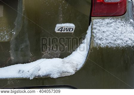 An Abbreviation 4wd - Four-wheel Drive - On Dirty Green Car Back