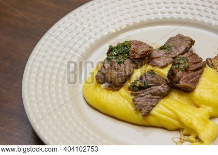 Ancho Steak With Mashed And Crispy Manioc Flour.