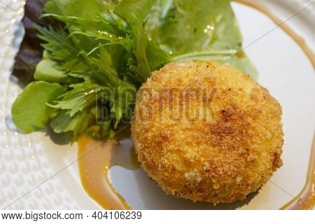 Ballotine De Chevre (goat Cheese, French) Fried With Honey Sauce.
