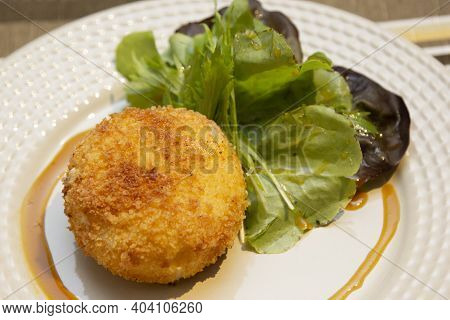 Ballotine De Chevre (goat Cheese, French) Fried With Honey Sauce.