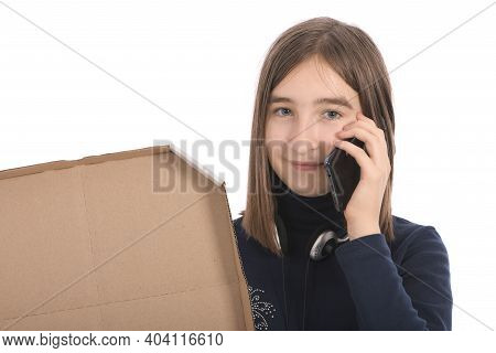 Pre-adolescent Girl Called On Black Smartphone. Isolated On White Background. High Resolution Photo.