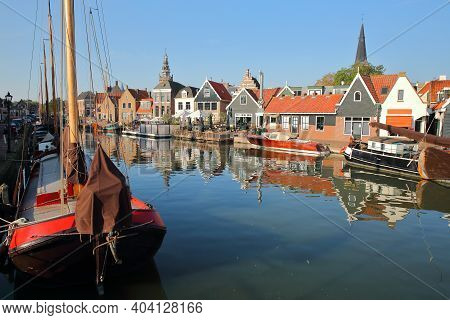 The Harbor Of Monnickendam, North Holland, Netherlands, With Reflections Of Historic Houses And Old 