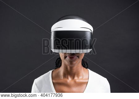 African American woman in virtual reality glasses smart technology
