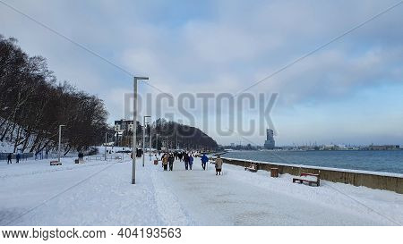 Gdynia, Poland - January 17, 2021: Winter Walk. People Walking On The Baltic Sea Boulevard In Gdynia