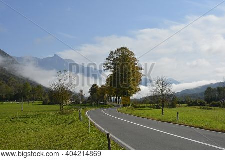 Low Clouds In The Autumn Landscape Along The Road Leading From The Italian Border To Kobarid In The 