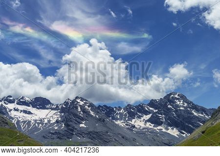 Iridescent Cloud Over The Road To Stelvio Pass, Sondrio Province, Lombardy, Italy, At Summer.