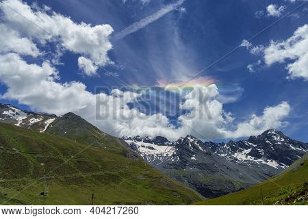 Iridescent Cloud Over The Road To Stelvio Pass, Sondrio Province, Lombardy, Italy, At Summer.