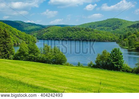 Rursee At Eifel National Park, Germany. Scenic View Of Lake Rursee And Surrounded Green Hills In Nor