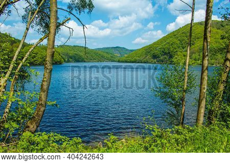 Rursee At Eifel National Park, Germany. Scenic View Of Lake Rursee And Surrounded Green Hills In Nor